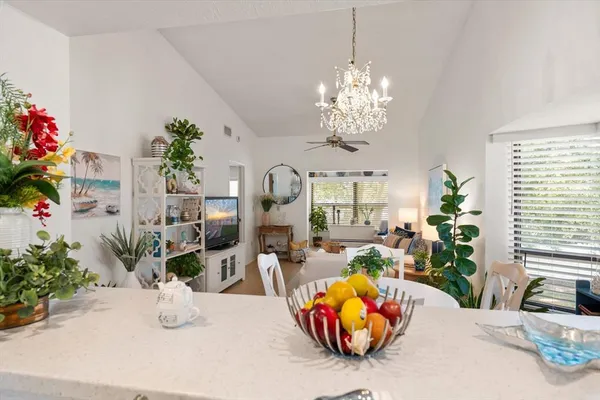 a view of a dining room with furniture window and chandelier