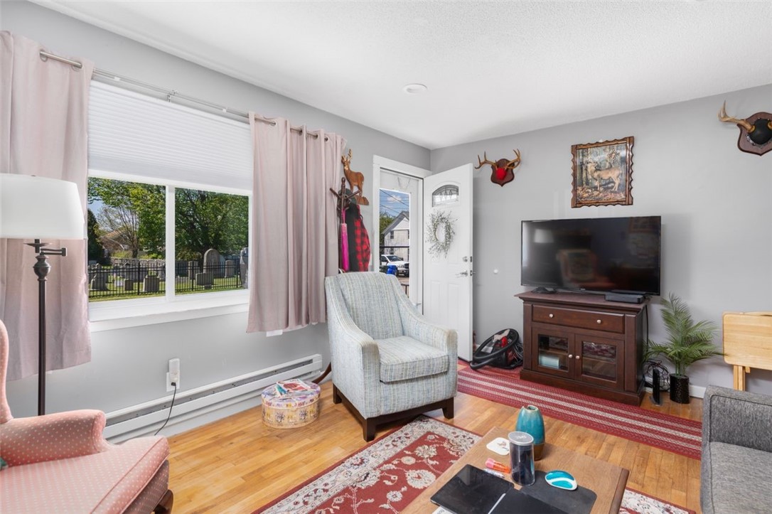 8 A Street Westerly, RI 02891 - Photo 3 of 24 6 A Left Unit Living Room with hardwood floors and recessed lighting