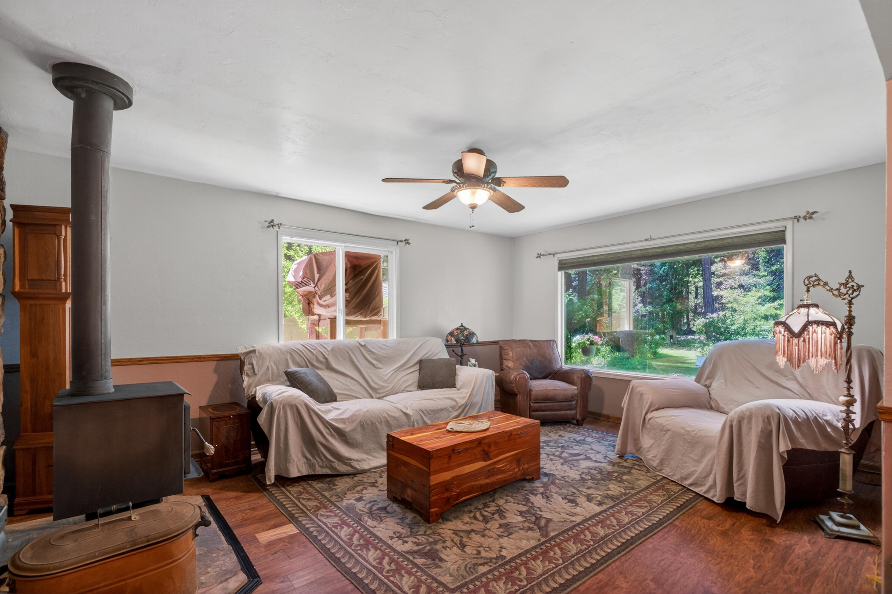 8015 Starlite Pines Road Shingletown, CA 96088 - Photo 9 of 38 a living room with furniture and a flat screen tv
