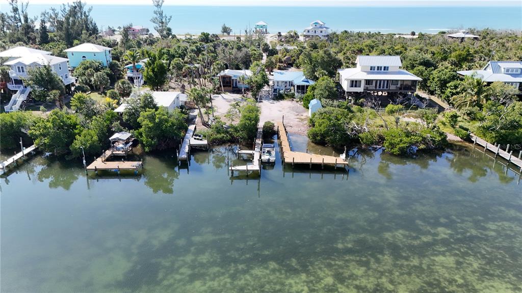 8092 Little Gasparilla Placida, FL 33946 - Photo 7 of 24 an aerial view of a house with a yard and lake view