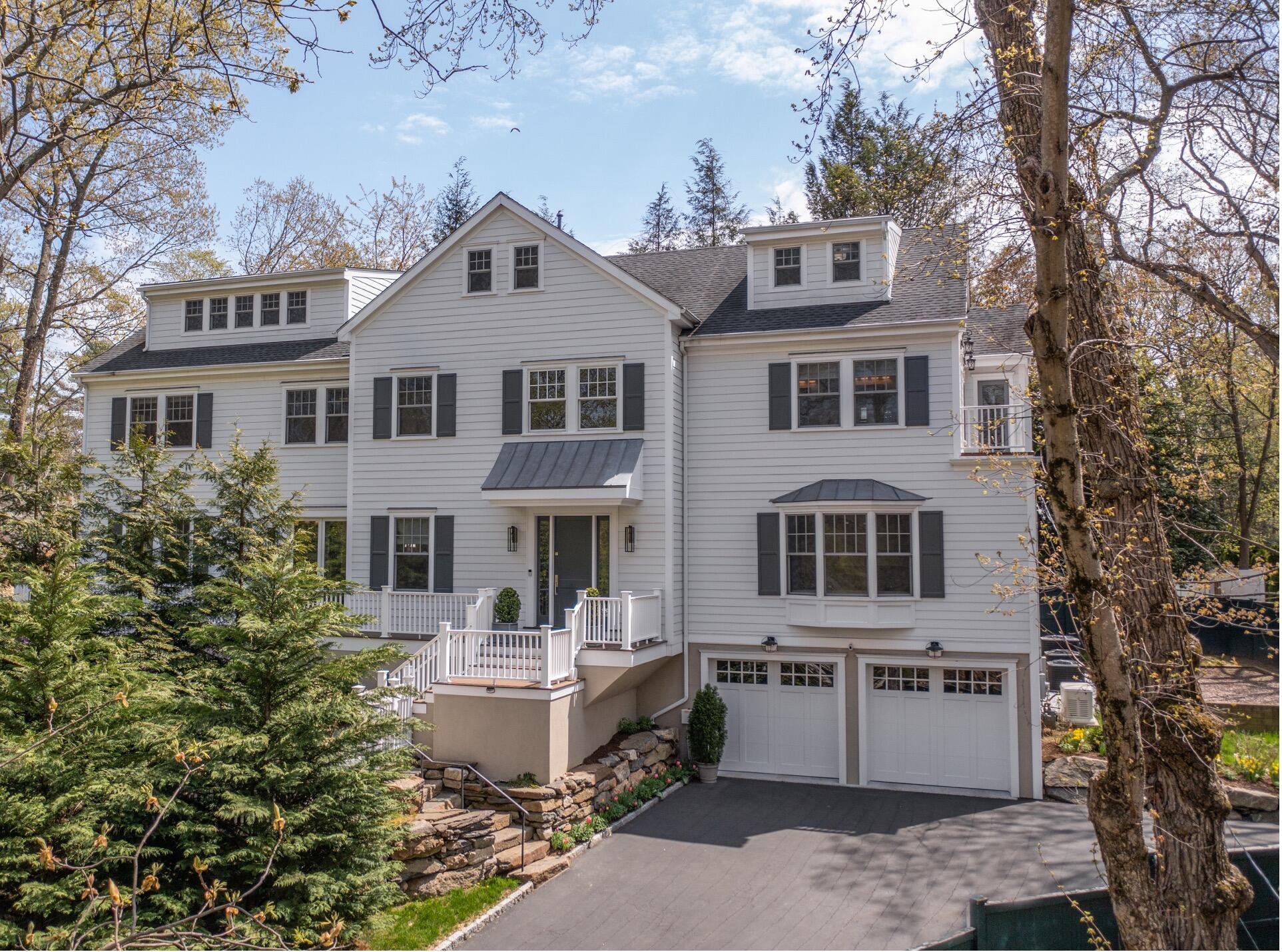 18 Cat Rock Road Cos Cob, CT 06807 - Photo 1 of 37 a front view of a house with a yard and fountain