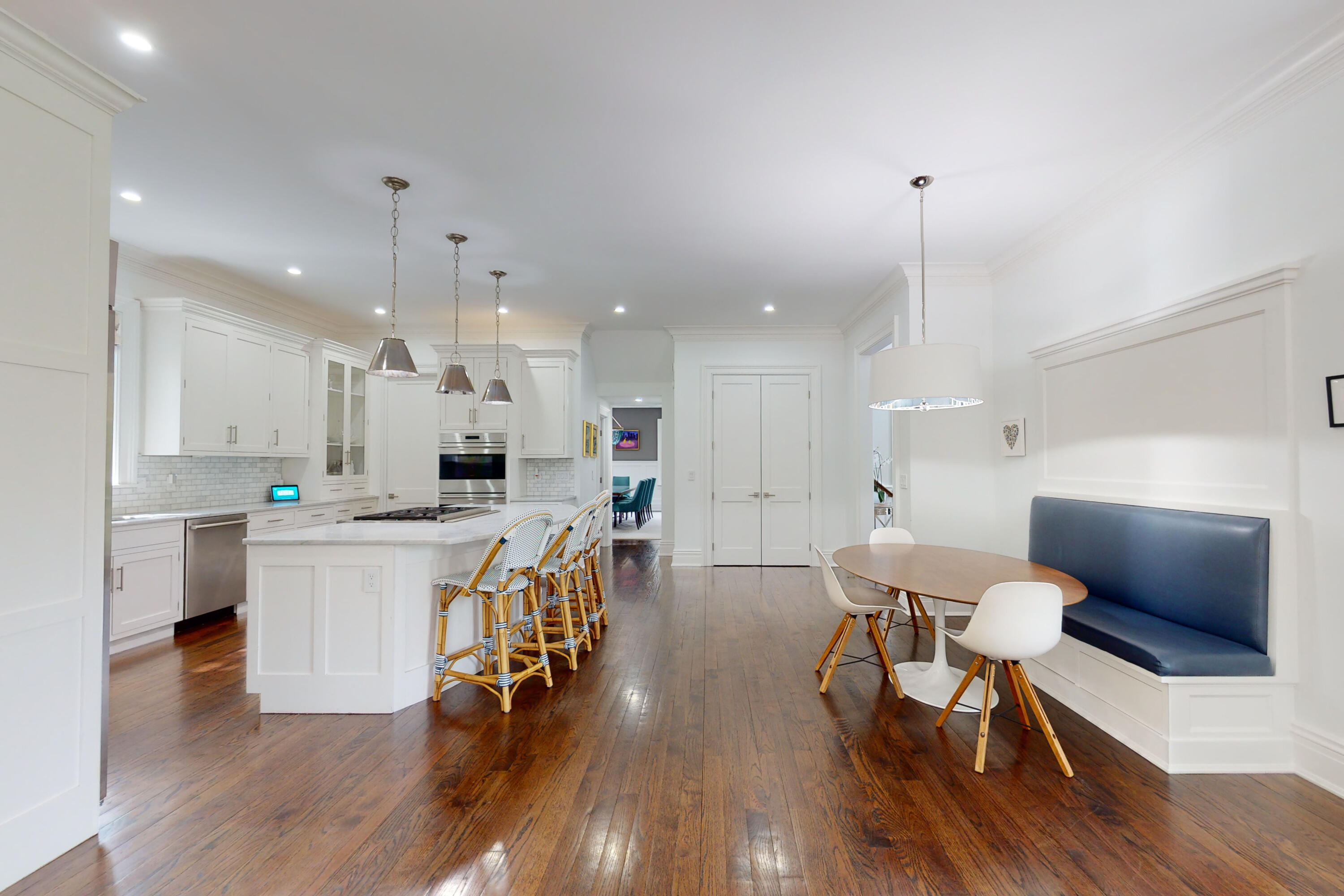 18 Cat Rock Road Cos Cob, CT 06807 - Photo 11 of 37 a large kitchen with a table and chairs