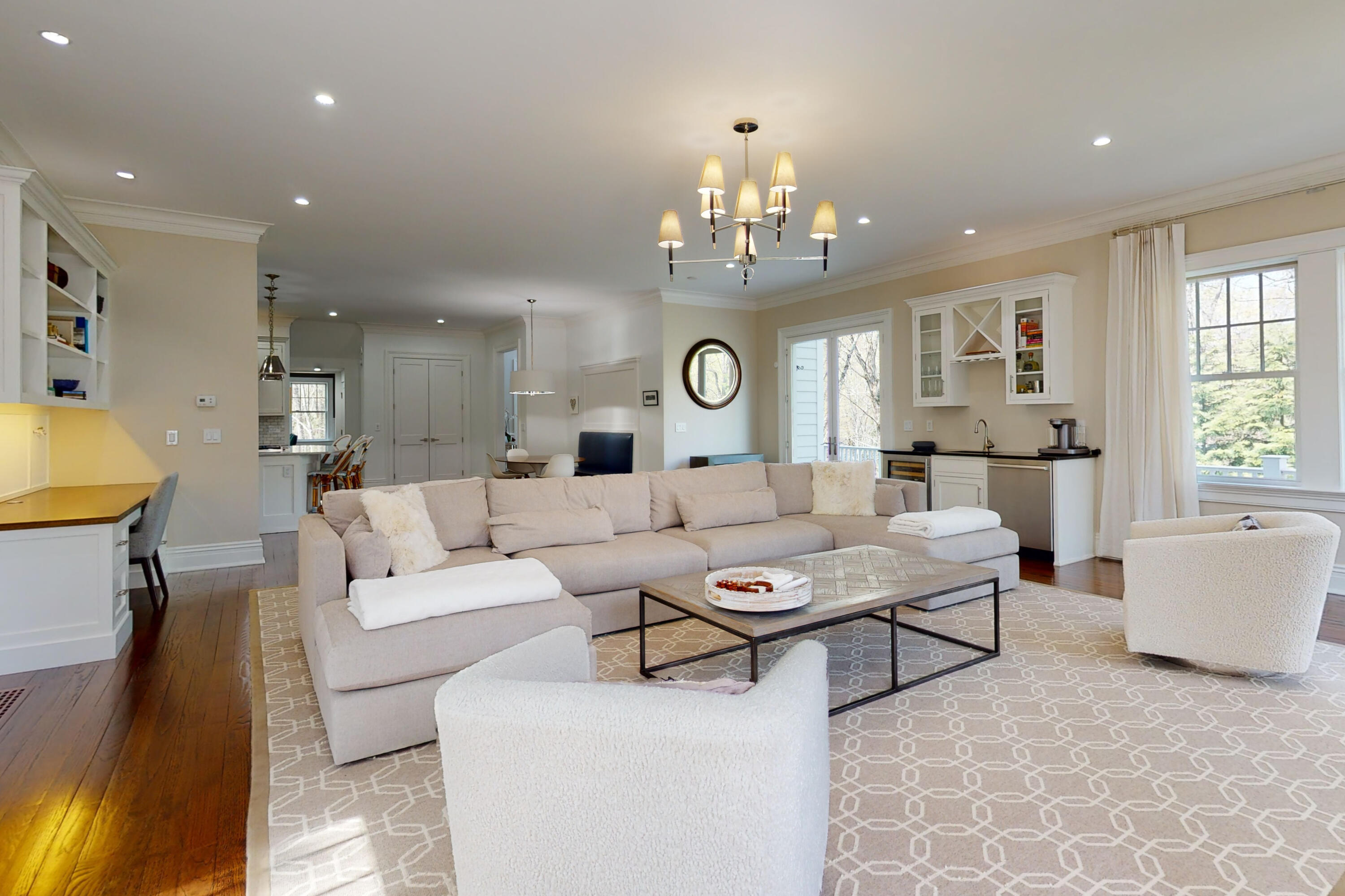 18 Cat Rock Road Cos Cob, CT 06807 - Photo 15 of 37 a living room with furniture and a chandelier