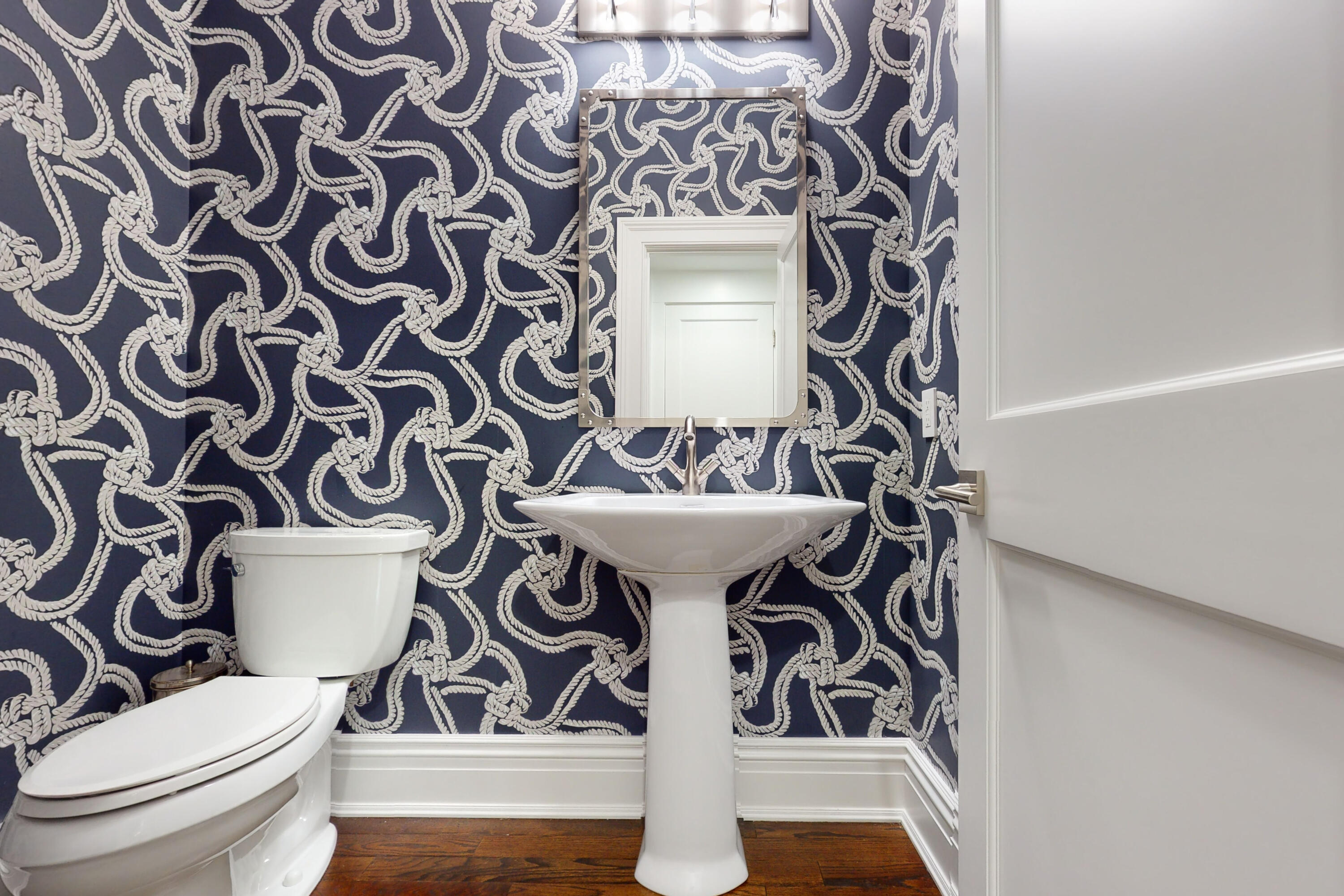 18 Cat Rock Road Cos Cob, CT 06807 - Photo 16 of 37 a bathroom with a sink and mirror with toilet