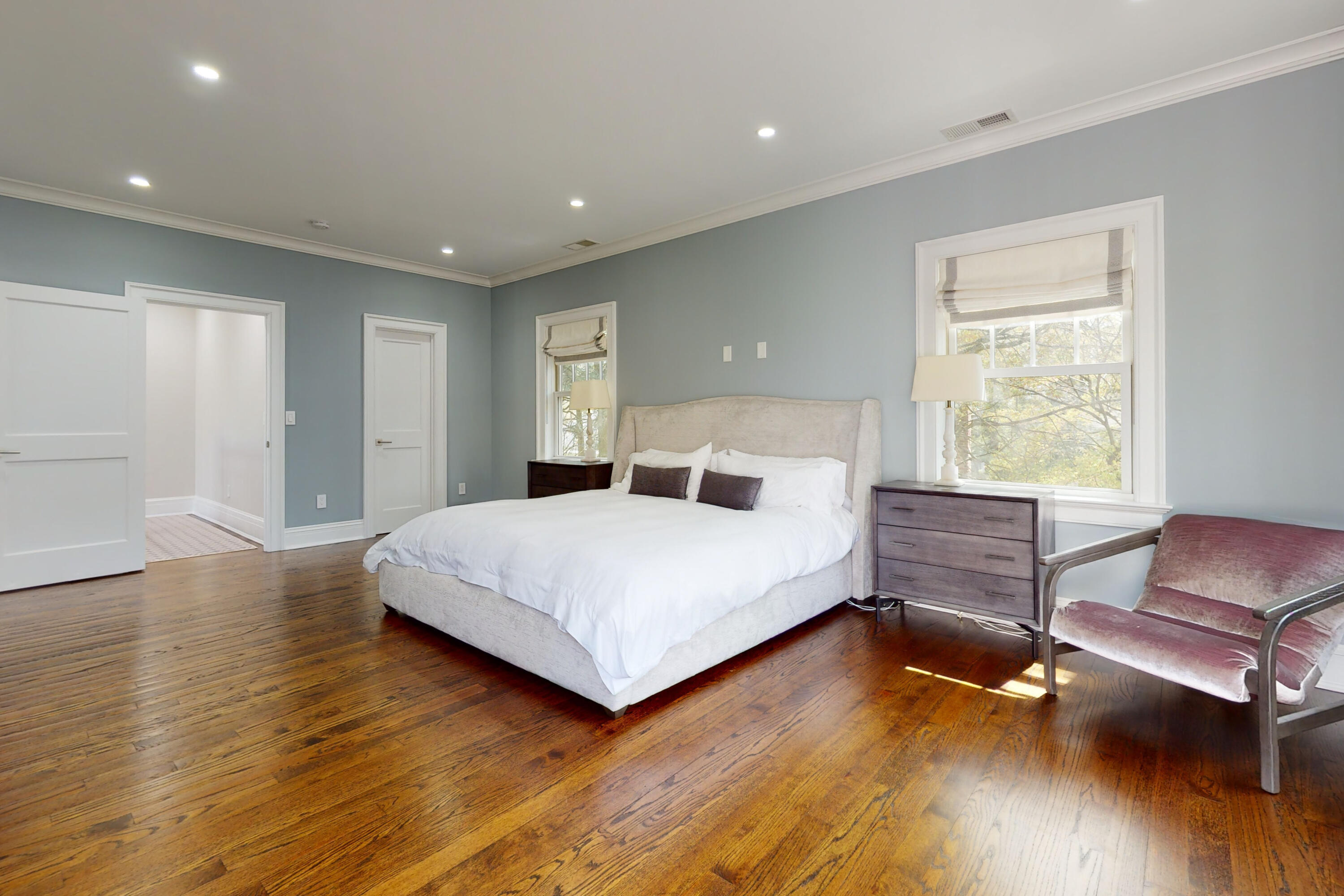18 Cat Rock Road Cos Cob, CT 06807 - Photo 18 of 37 a bedroom with a bed and wooden floor