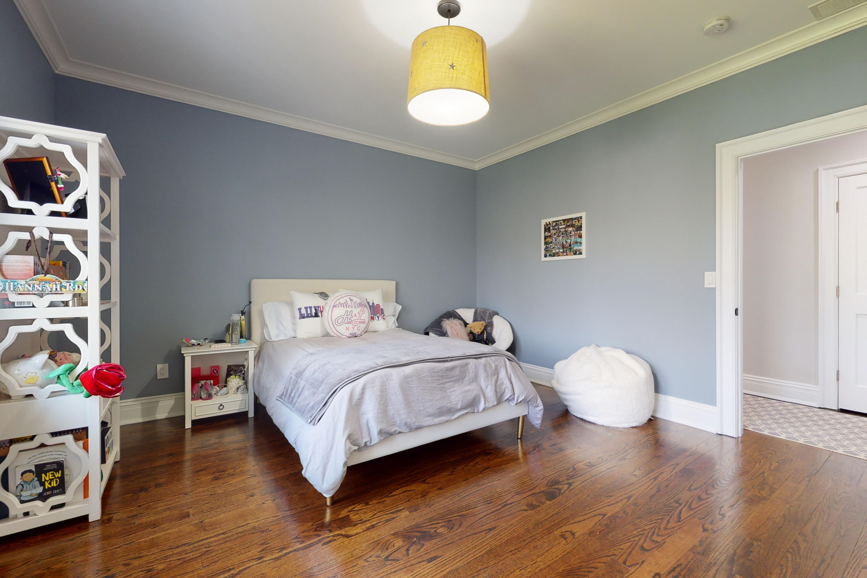 18 Cat Rock Road Cos Cob, CT 06807 - Photo 21 of 37 a bedroom with a bed and a chandelier