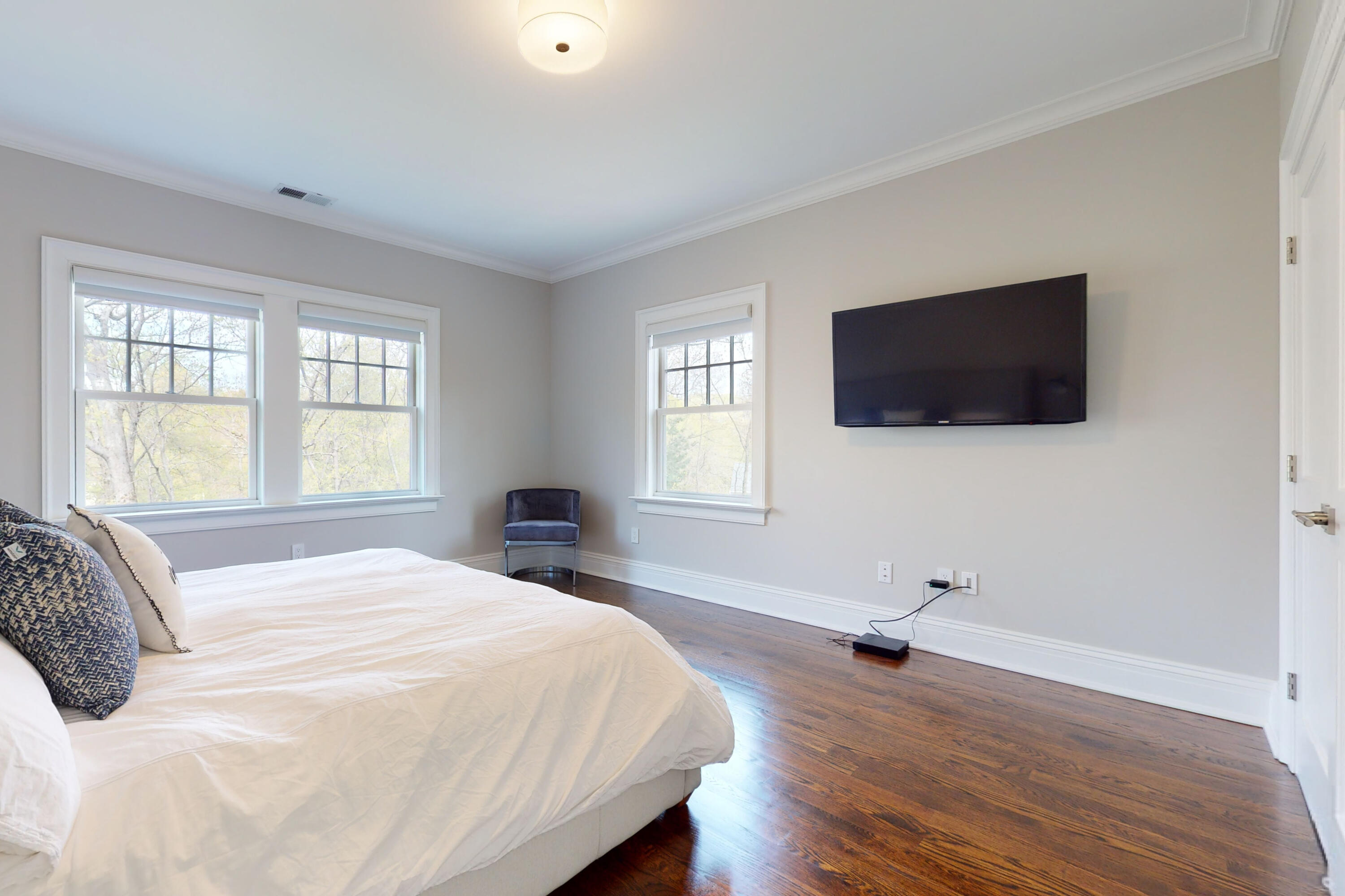18 Cat Rock Road Cos Cob, CT 06807 - Photo 23 of 37 a bedroom with a flat screen tv and a window