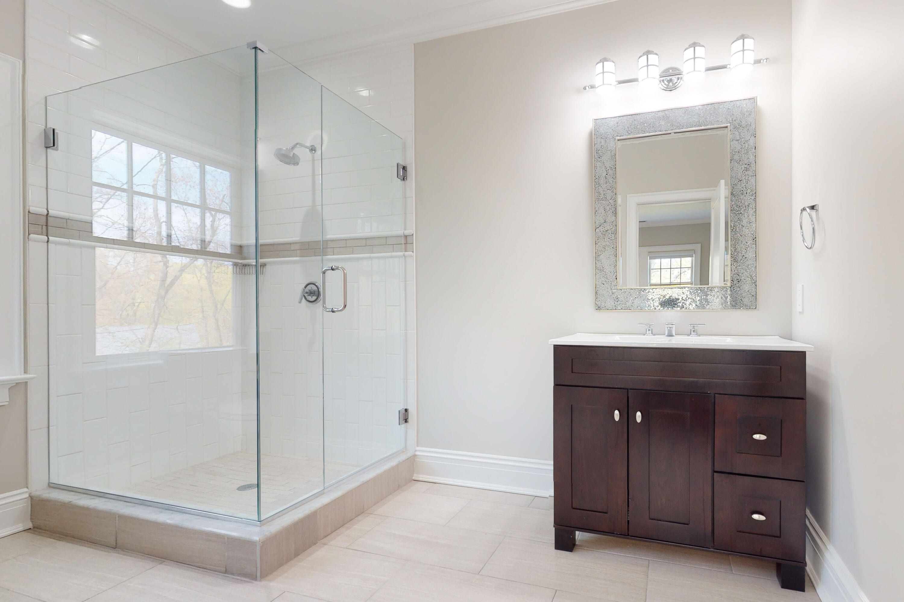 18 Cat Rock Road Cos Cob, CT 06807 - Photo 24 of 37 a bathroom with a shower a sink and a mirror
