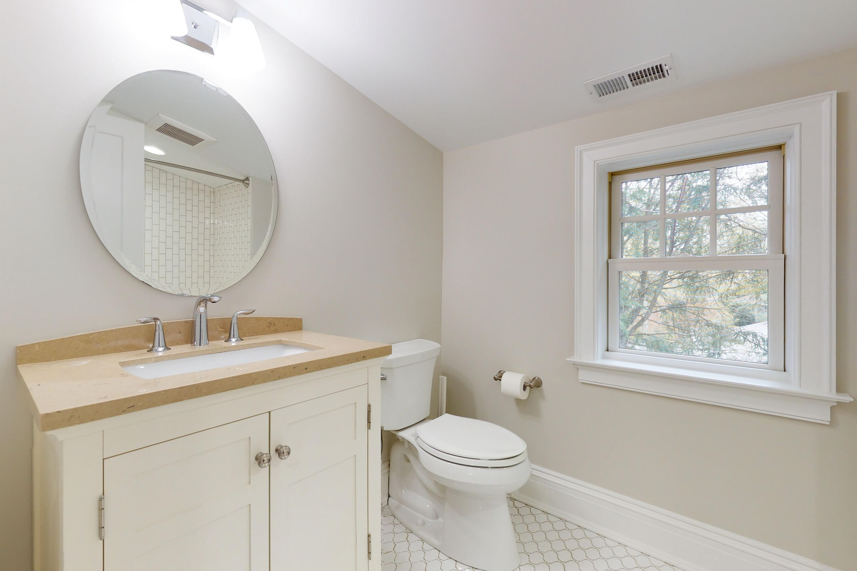 18 Cat Rock Road Cos Cob, CT 06807 - Photo 28 of 37 a bathroom with a toilet a sink and mirror
