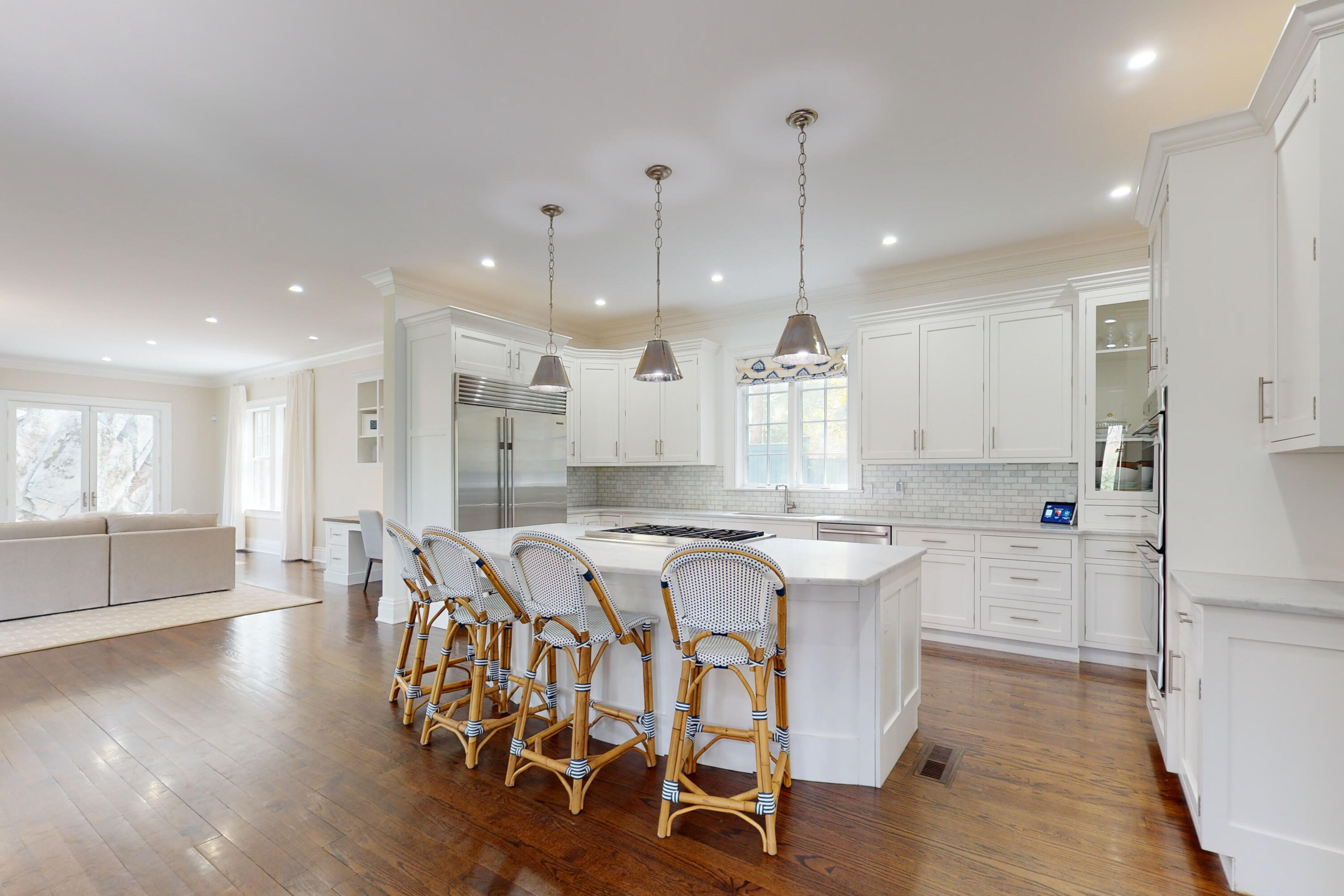 18 Cat Rock Road Cos Cob, CT 06807 - Photo 8 of 37 a kitchen with stainless steel appliances a dining table chairs stove refrigerator and cabinets