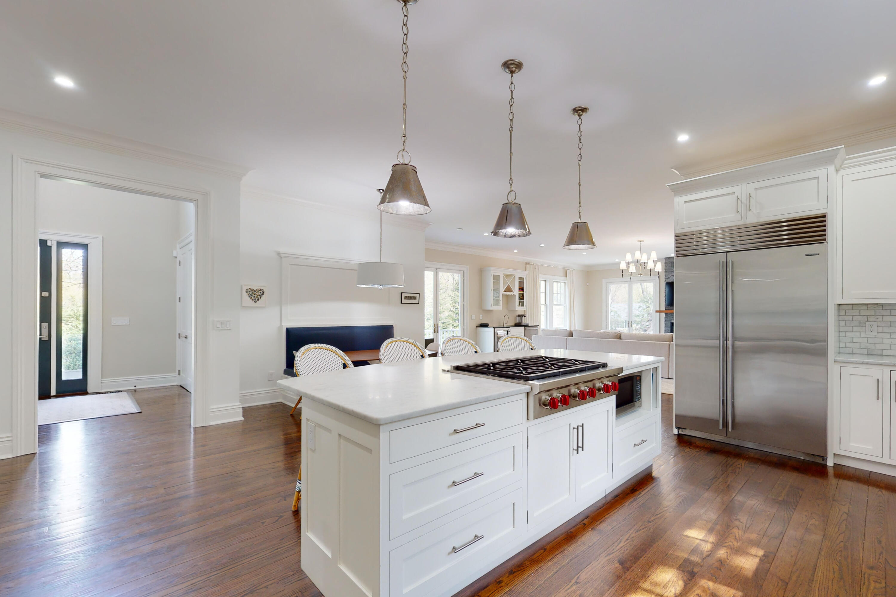18 Cat Rock Road Cos Cob, CT 06807 - Photo 9 of 37 a kitchen with stainless steel appliances granite countertop a sink a stove and a wooden floor