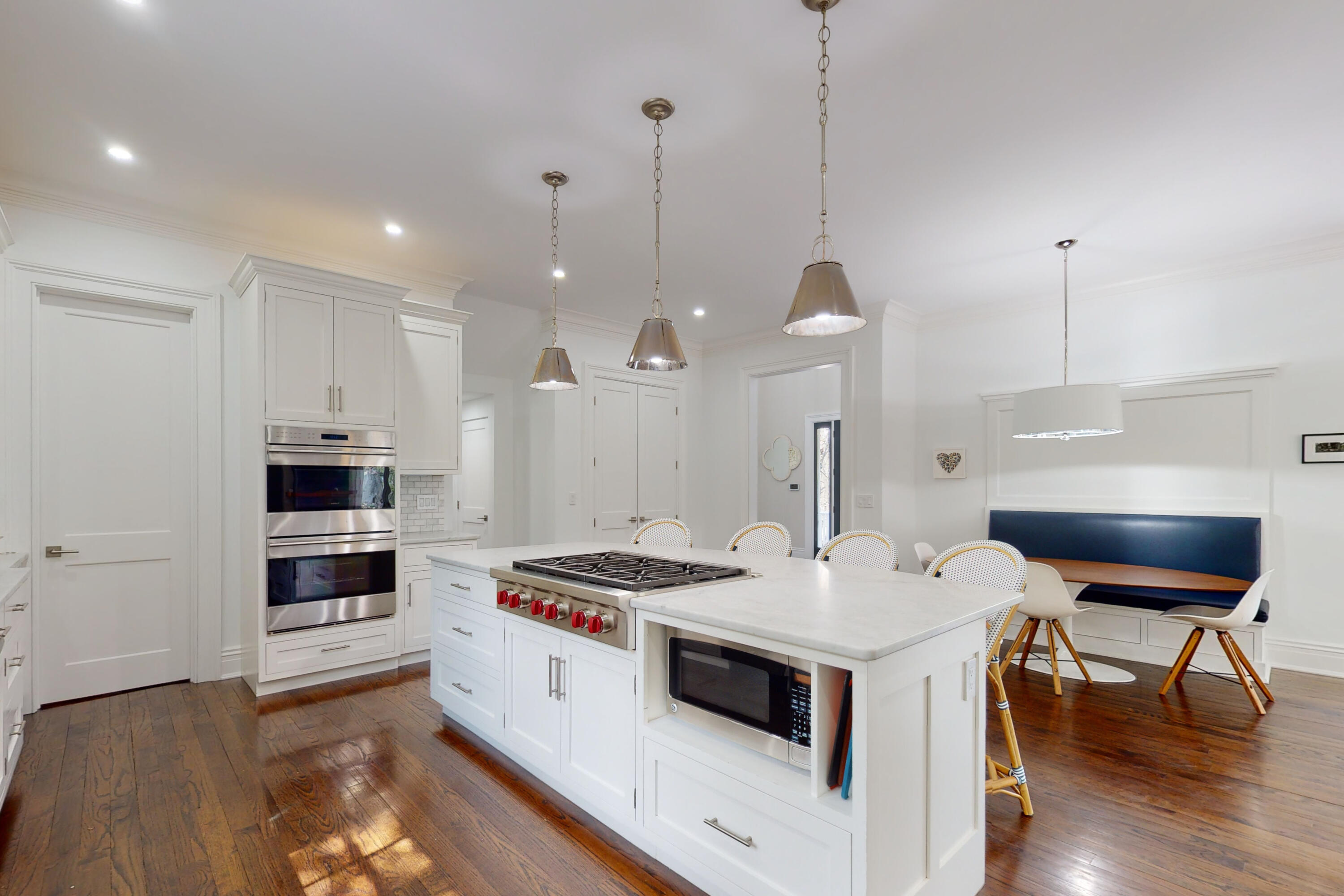 18 Cat Rock Road Cos Cob, CT 06807 - Photo 10 of 37 a kitchen with a stove a kitchen island a dining table and chairs
