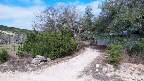 a view of a pathway with a yard