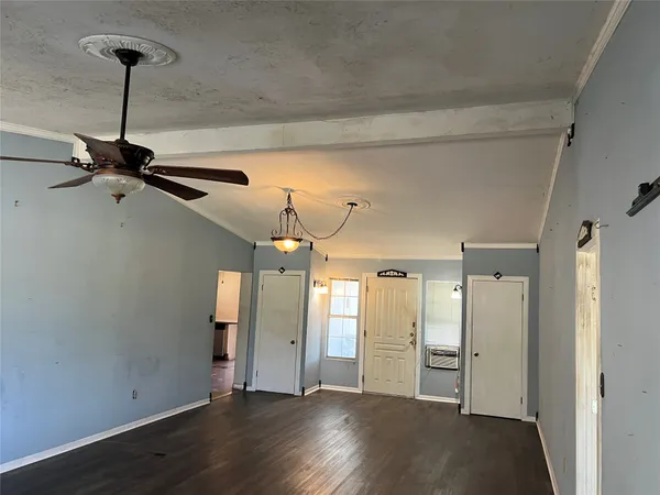 a view of a room with wooden floor closet and windows