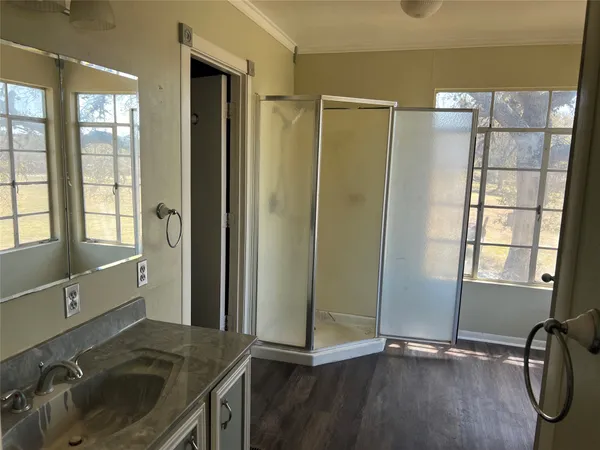 a view of a sink and a window in an empty room