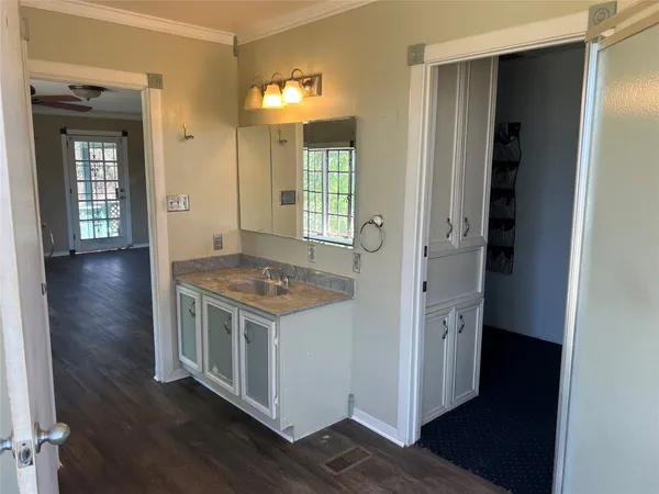 a view of kitchen and wooden floor