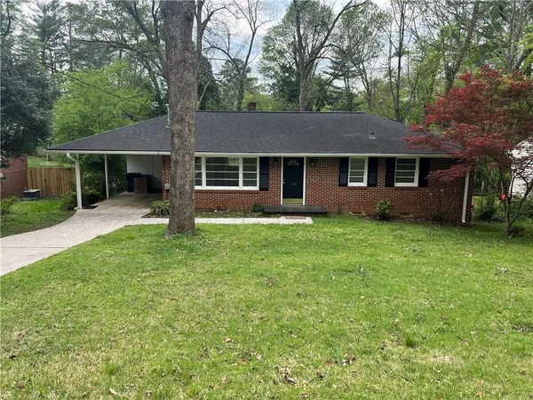 front view of a house with a yard