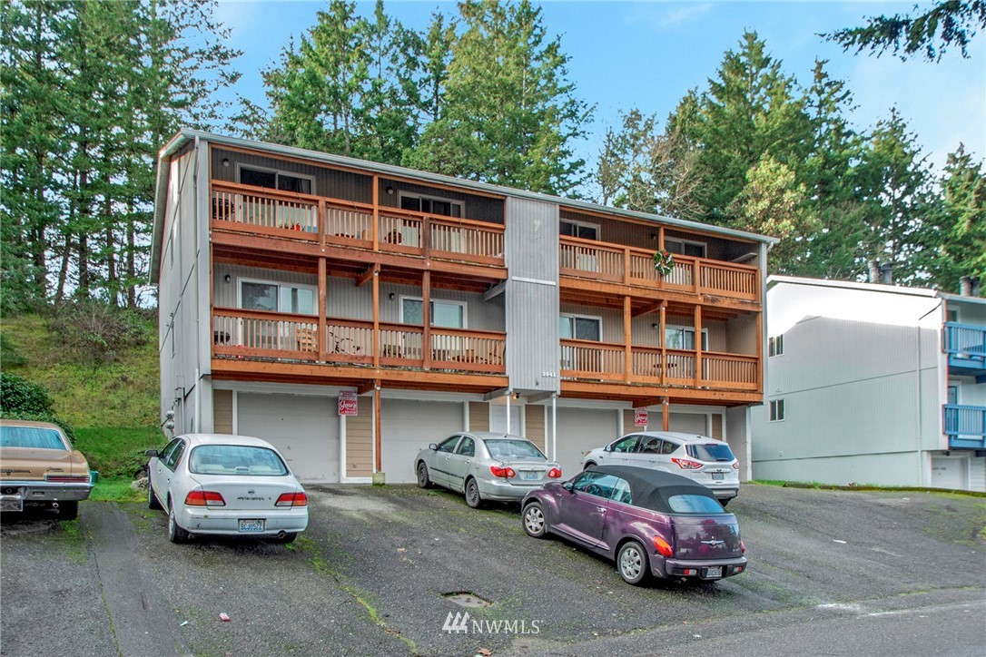 3941 Mason Loop Road Tacoma, WA 98409 - Photo 2 of 16 a car parked in front of a building
