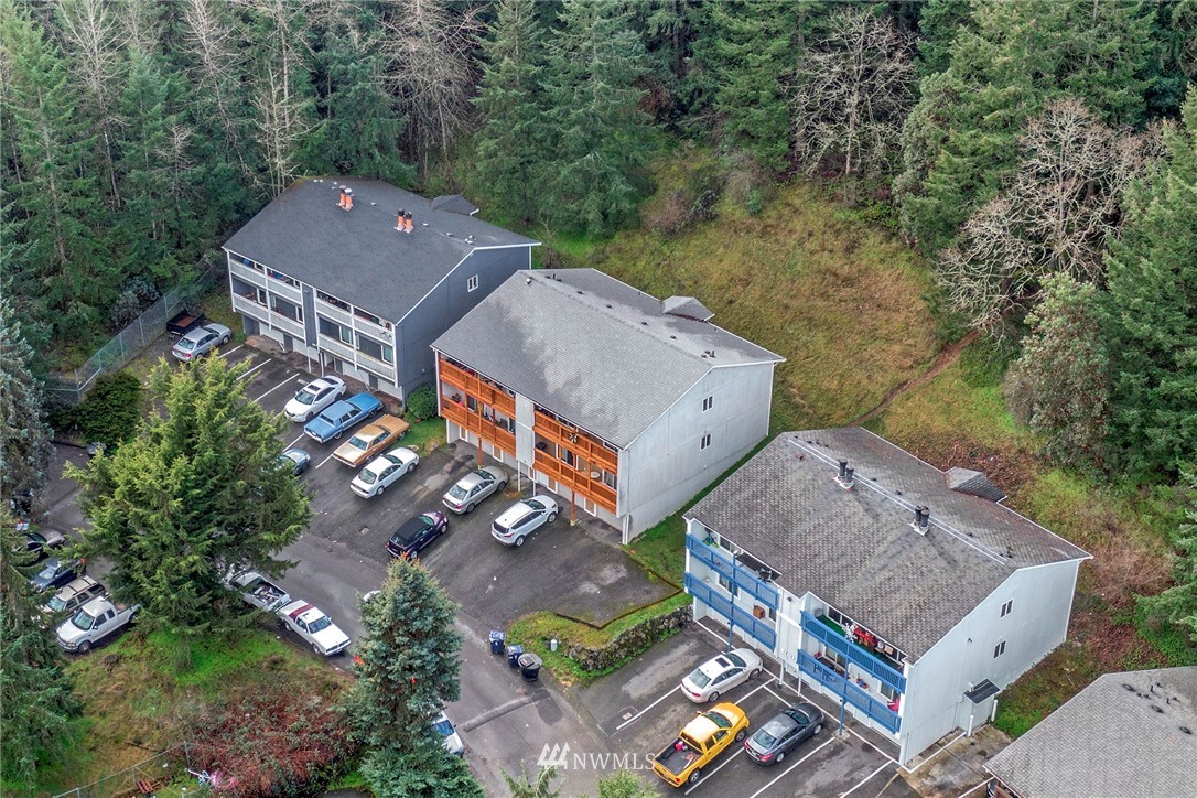 3941 Mason Loop Road Tacoma, WA 98409 - Photo 11 of 16 an aerial view of a house with a garden