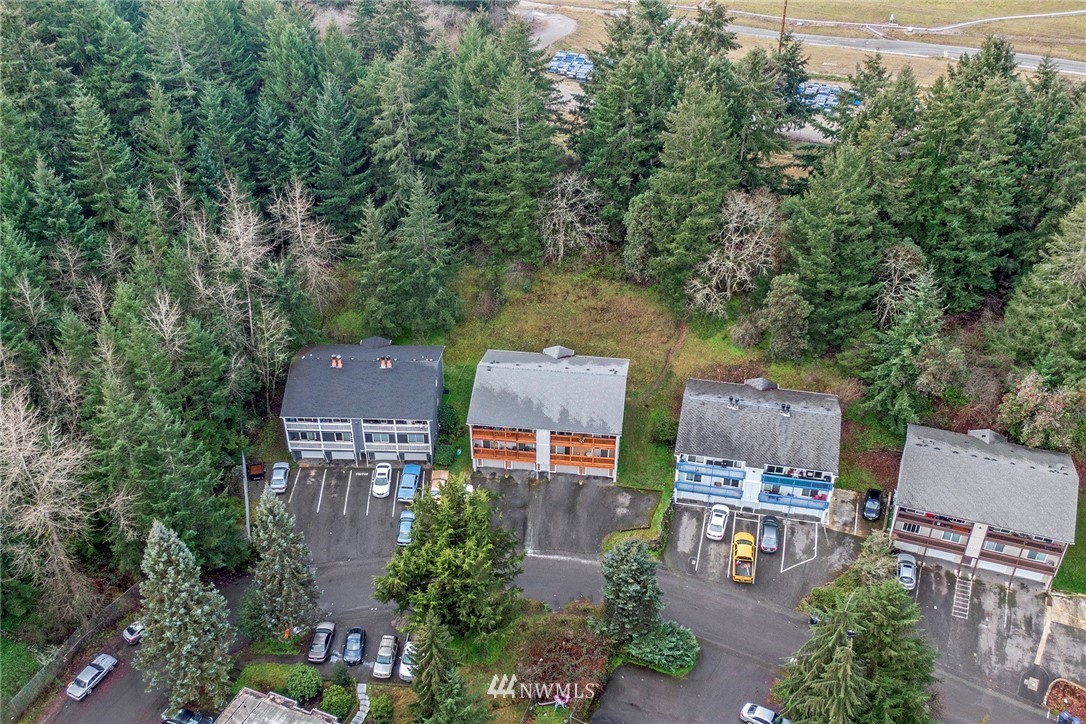 3941 Mason Loop Road Tacoma, WA 98409 - Photo 13 of 16 an aerial view of a house with a yard