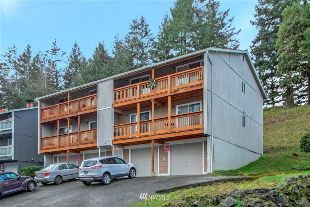 3941 Mason Loop Road Tacoma, WA 98409 - Photo 3 of 16 a couple of cars parked in front of a house