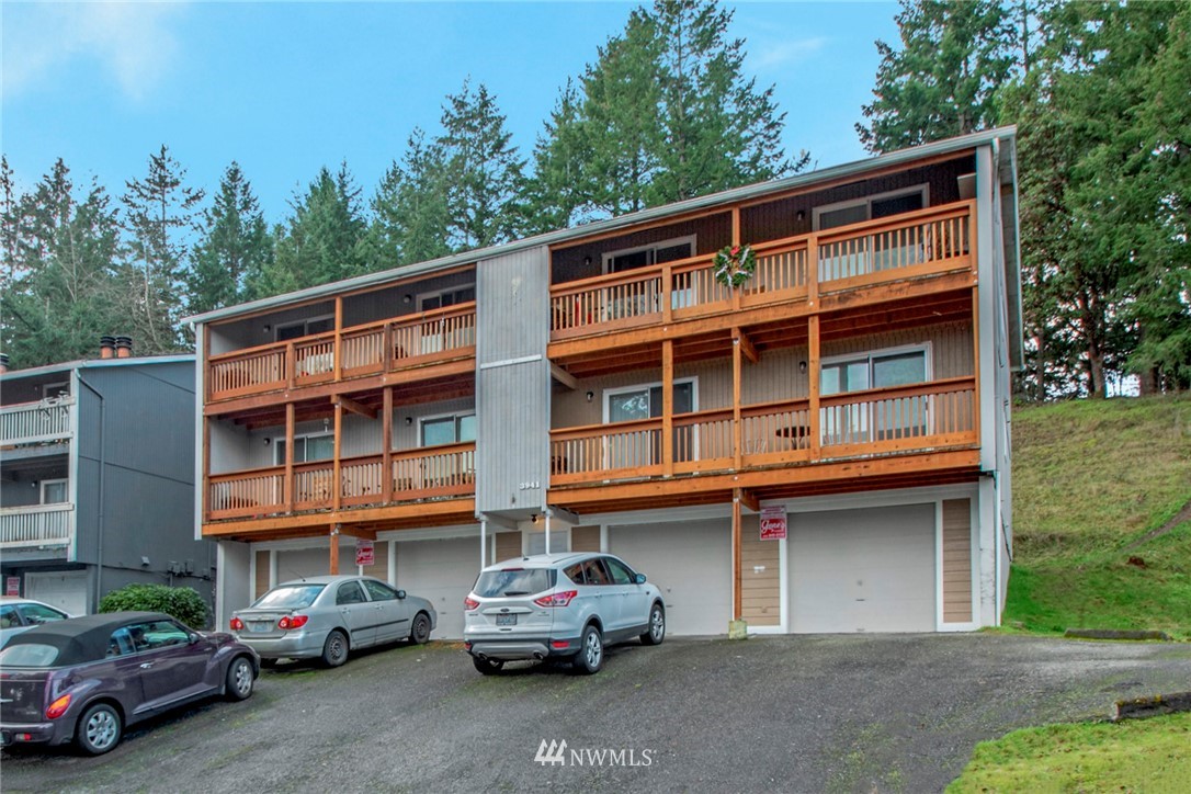 3941 Mason Loop Road Tacoma, WA 98409 - Photo 4 of 16 a car parked in front of a building