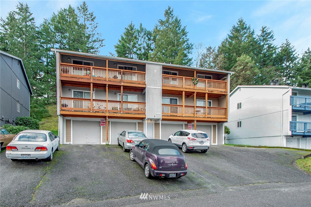 3941 Mason Loop Road Tacoma, WA 98409 - Photo 5 of 16 a car parked in front of a building