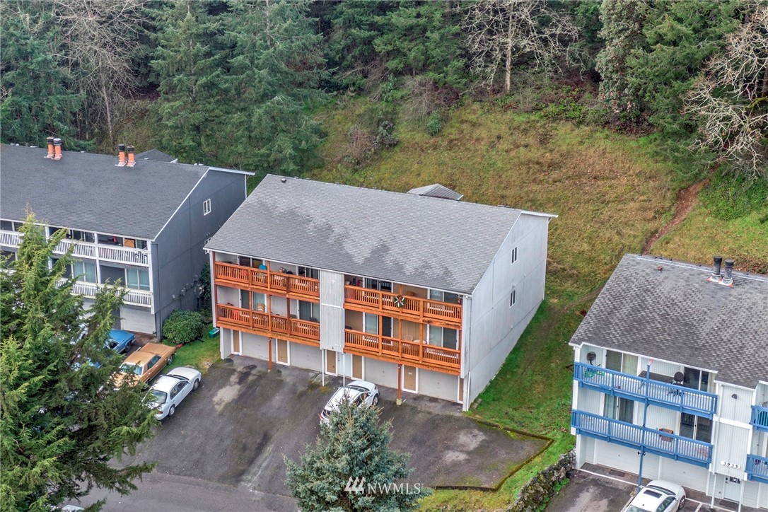 3941 Mason Loop Road Tacoma, WA 98409 - Photo 8 of 16 an aerial view of a house with a yard