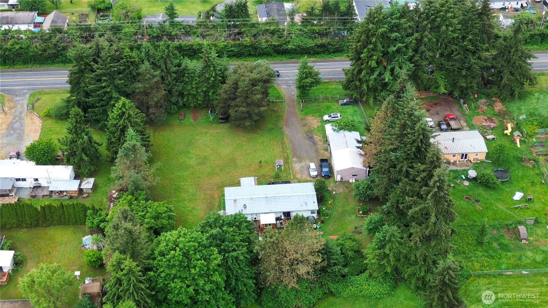 7185 Old Highway 99 North Road Burlington, WA 98233 - Photo 22 of 26 an aerial view of a house with a yard basket ball court and outdoor seating