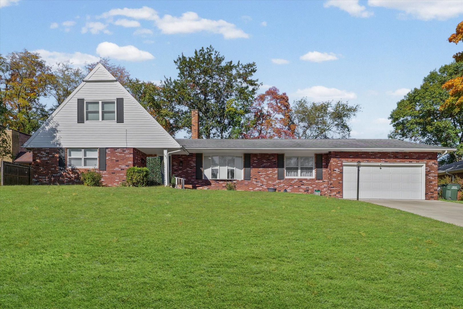 101 Thornhill Drive Danville, IL 61832 - Photo 1 of 42 a front view of a house with a garden and trees