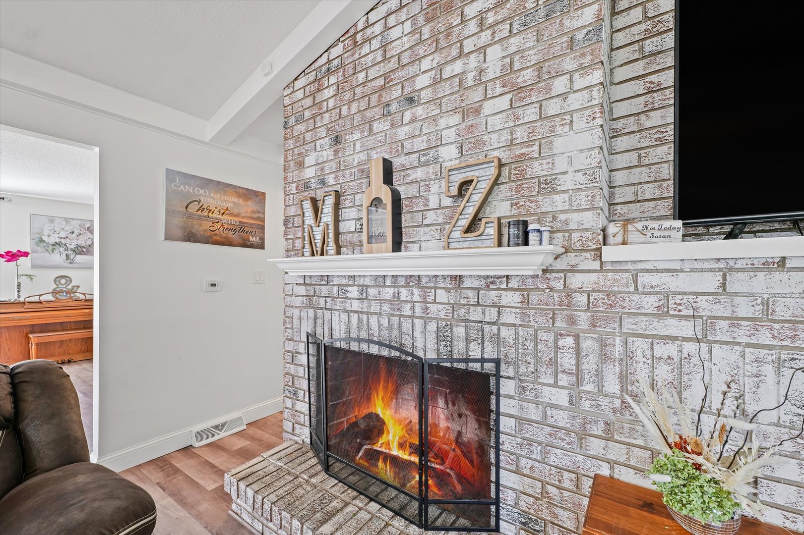 101 Thornhill Drive Danville, IL 61832 - Photo 13 of 42 a living room with furniture and a fireplace