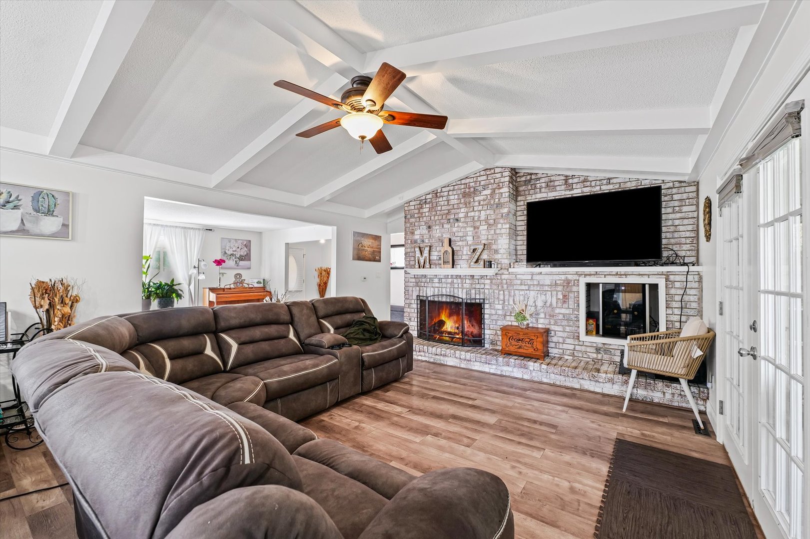 101 Thornhill Drive Danville, IL 61832 - Photo 14 of 42 a living room with furniture a fireplace and a flat screen tv