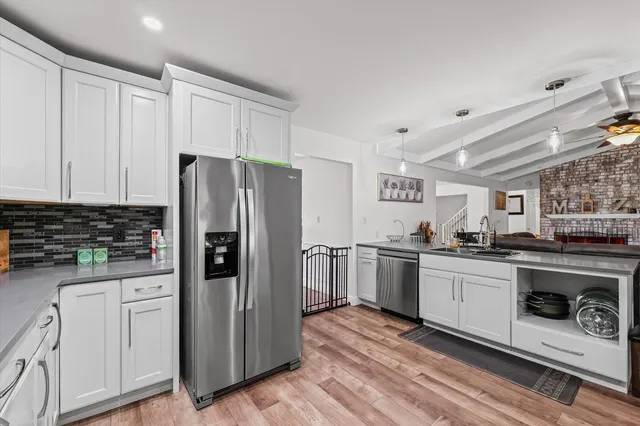 a bathroom with a sink a mirror and a toilet