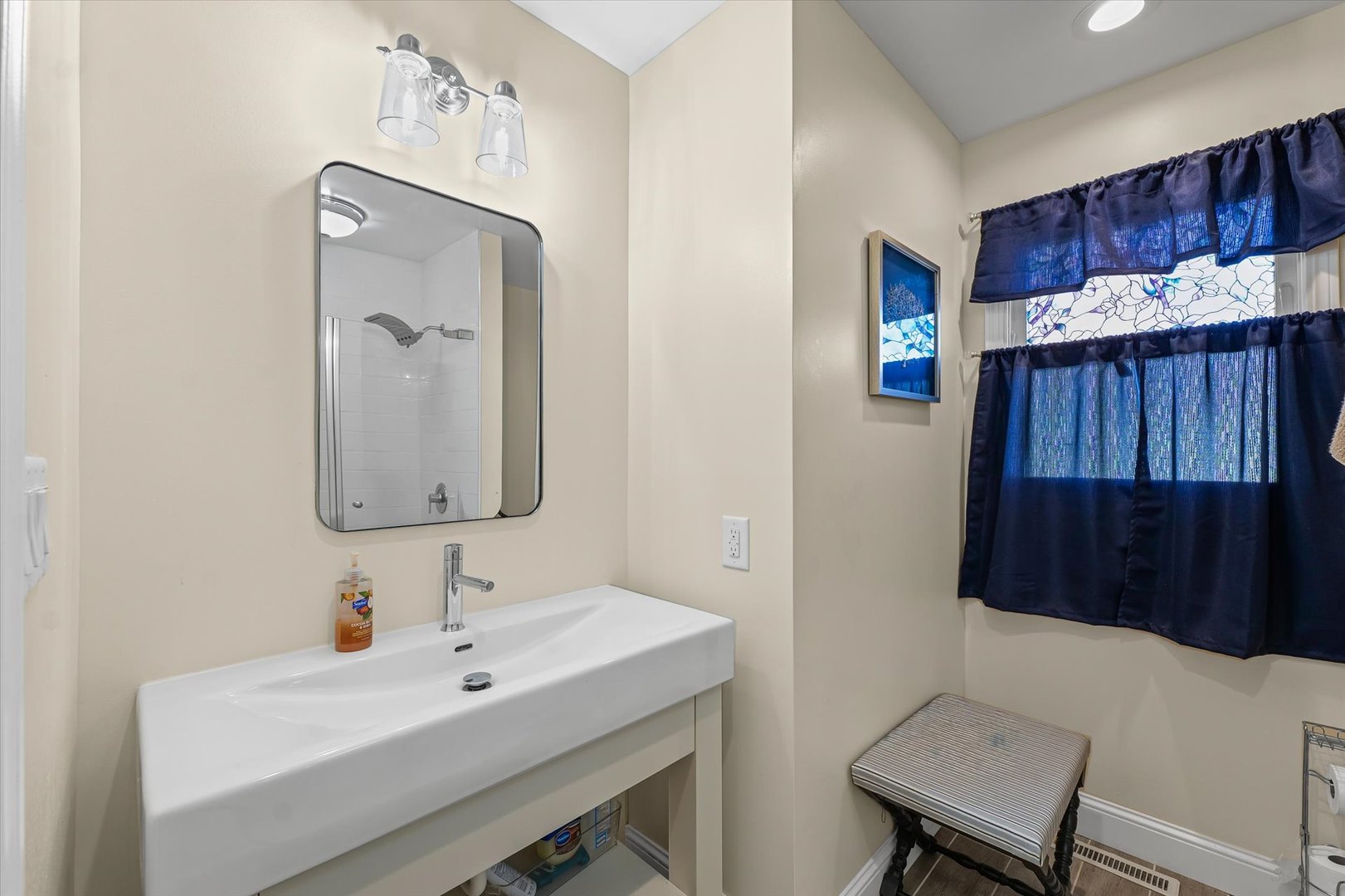 101 Thornhill Drive Danville, IL 61832 - Photo 21 of 42 a bathroom with a sink a mirror and a toilet