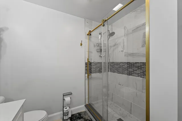 a bedroom with a bed and dresser