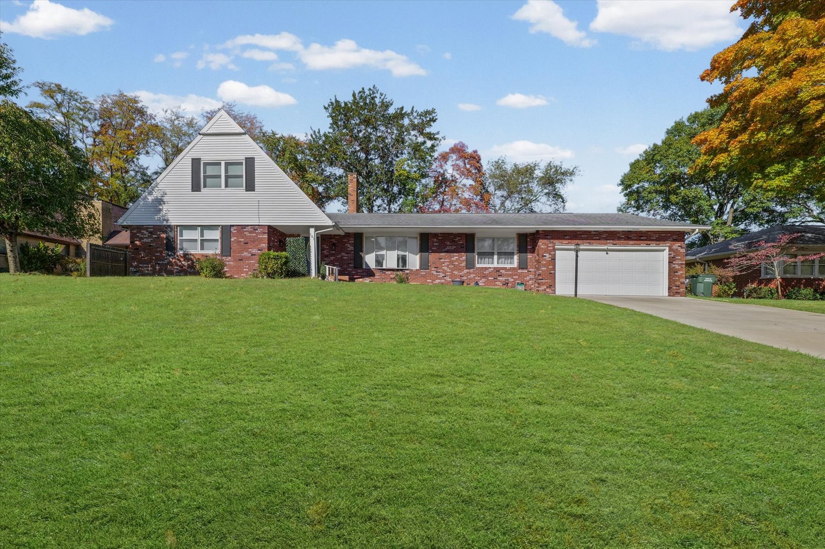 101 Thornhill Drive Danville, IL 61832 - Photo 3 of 42 a view of a house next to a big yard and large trees