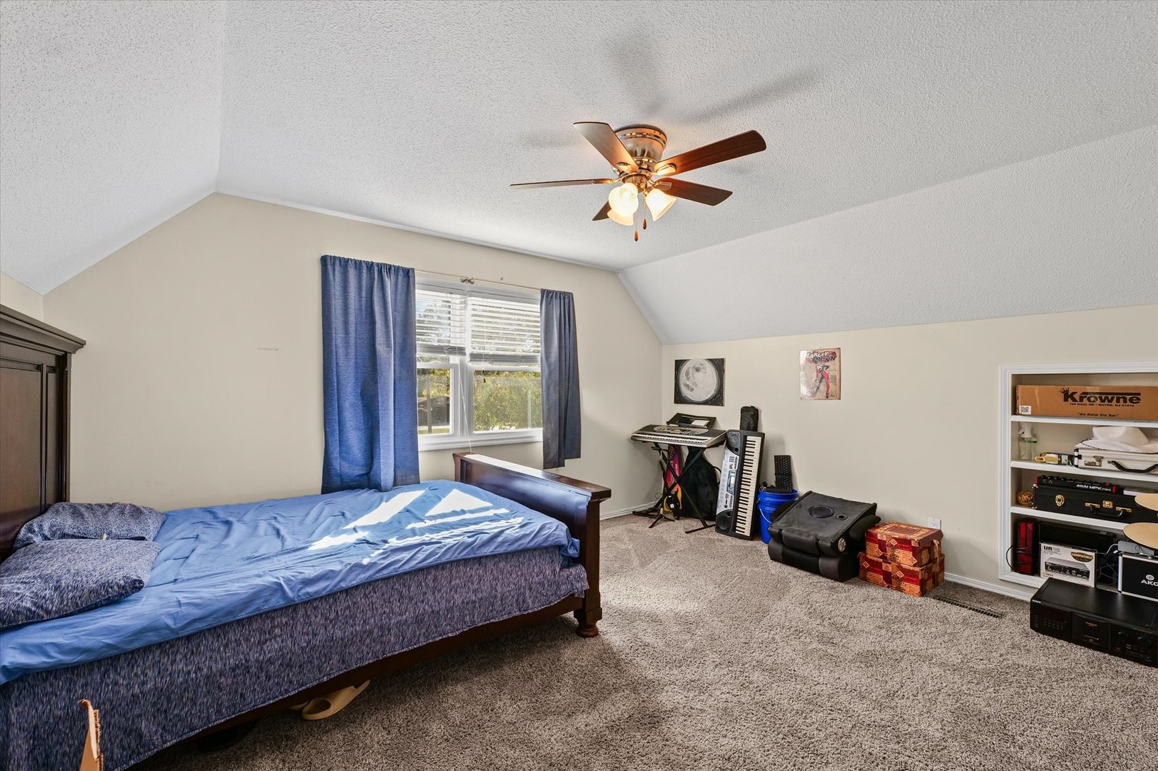 101 Thornhill Drive Danville, IL 61832 - Photo 33 of 42 a bedroom with a bed and a chandelier