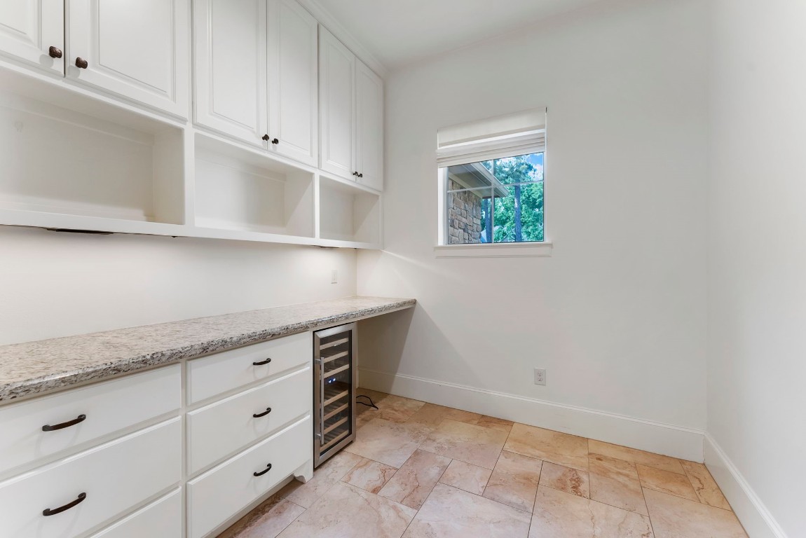 3810 Oreana Court Spring, TX 77386 - Photo 21 of 44 a kitchen with white cabinets and window