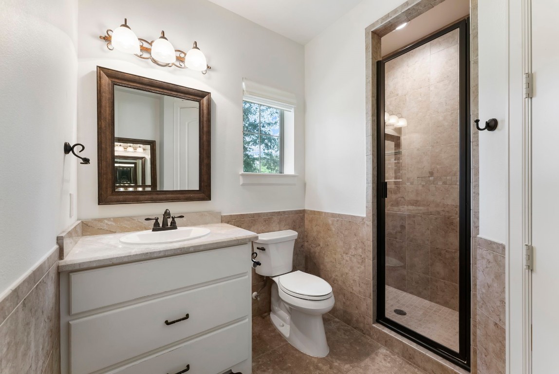 3810 Oreana Court Spring, TX 77386 - Photo 36 of 44 a bathroom with a toilet sink and mirror