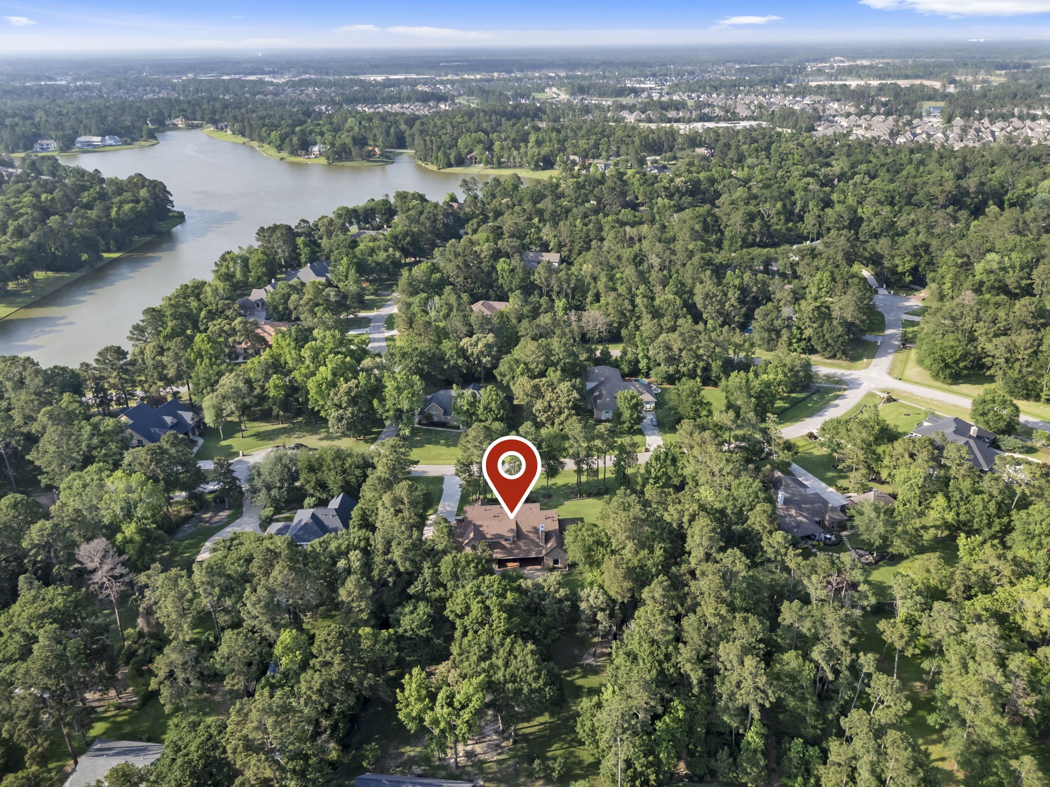 3810 Oreana Court Spring, TX 77386 - Photo 43 of 44 an aerial view of a house with a lake view