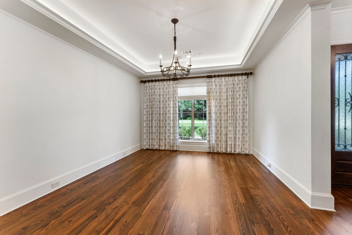 3810 Oreana Court Spring, TX 77386 - Photo 5 of 44 a view of a room with wooden floor chandelier and a window