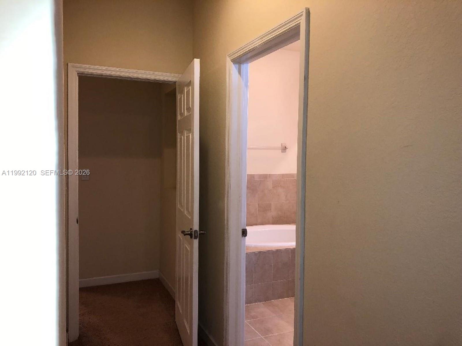 17000 Southwest 90th Terrace Miami, FL 33196 - Photo 20 of 56 a bathroom with a glass door