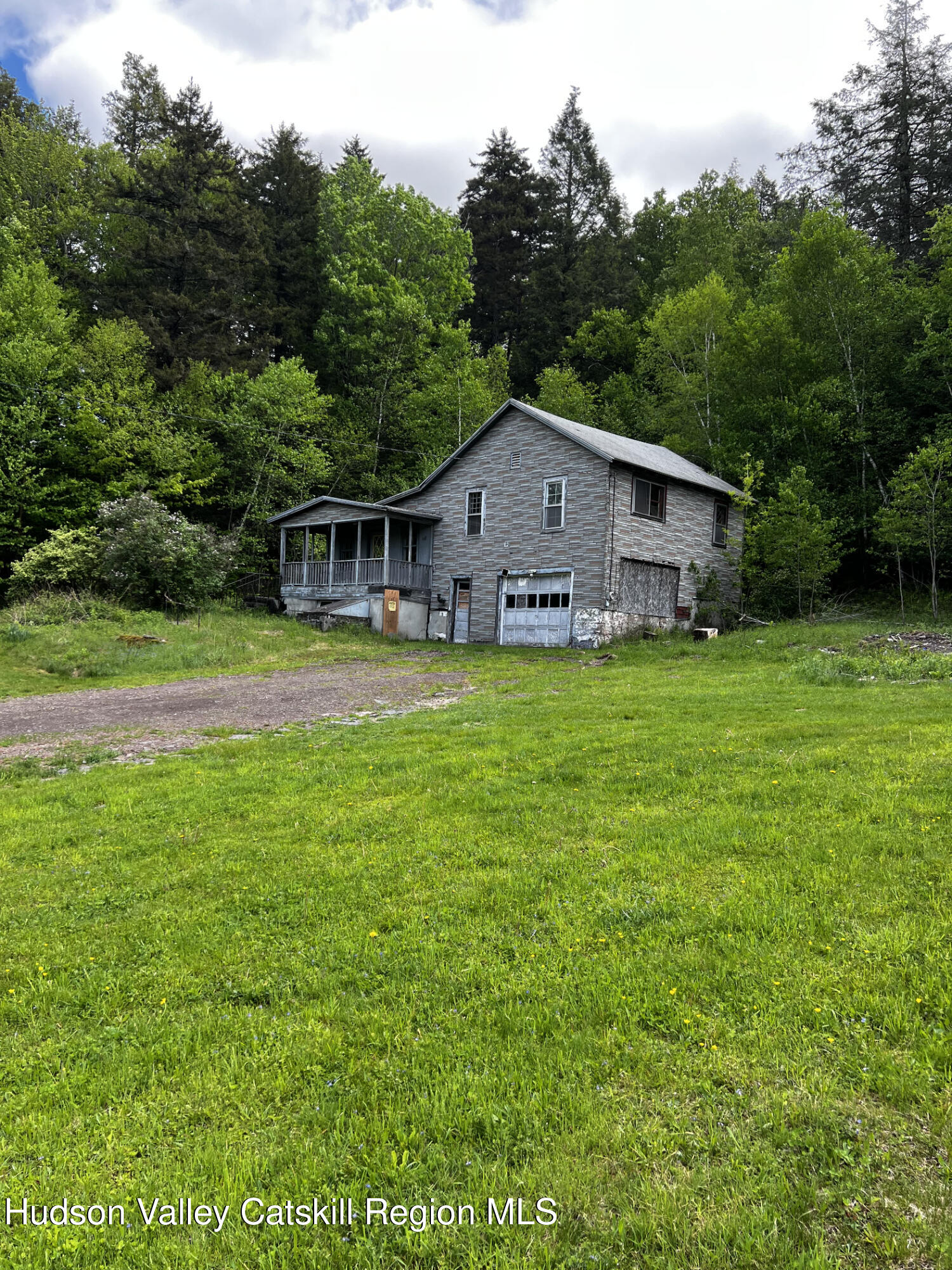 217 Platte Clove Road Elka Park, NY 12427 - Photo 1 of 18 a view of a house with a yard and sitting area