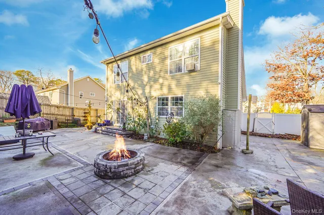 a building outdoor space with patio furniture and potted plants