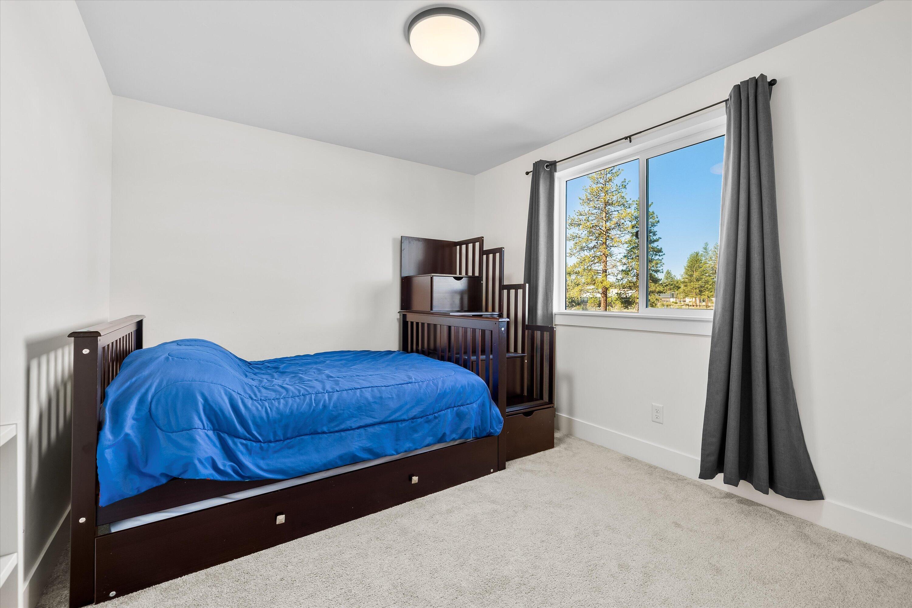 60903 Southeast Epic Place Bend, OR 97702 - Photo 32 of 48 a bedroom with a bed and a window