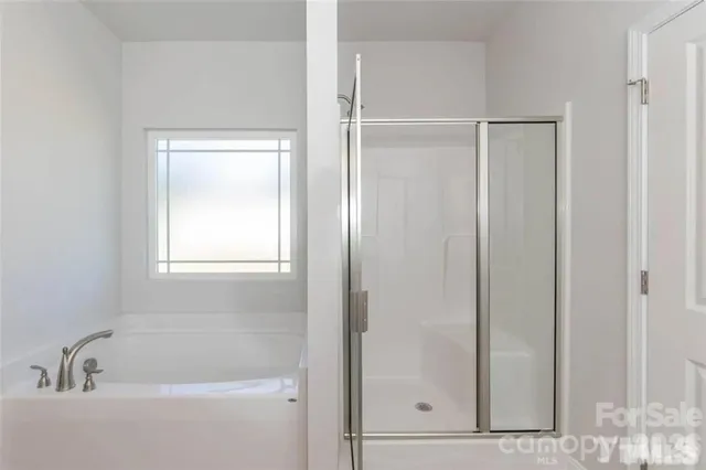 a kitchen with kitchen island granite countertop a stove oven and a wooden floors