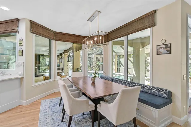 a spacious bathroom with a double vanity sink a mirror and a bathtub
