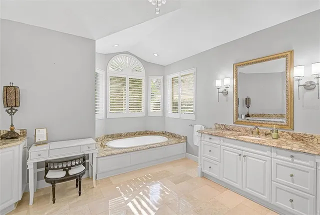 a view of a backyard with table and chairs under an umbrella
