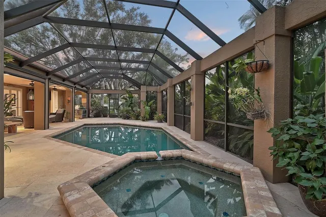 a dining room with furniture a rug and a chandelier