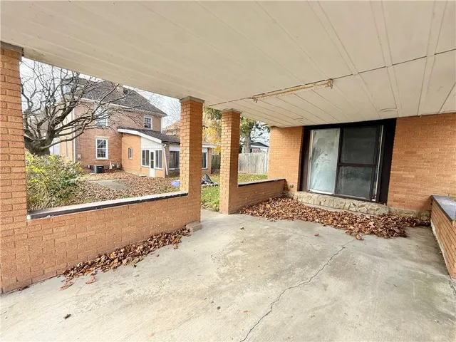 a view of a house with a snow in the yard